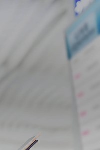 woman looking at a timetable on a screen