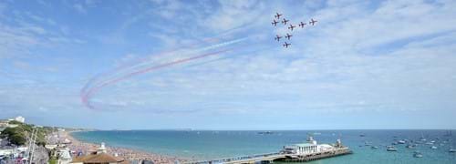 bournemouth pier airshow red arrows in a blue sky 